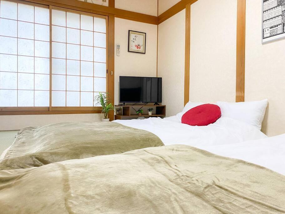 อพาร์ทเม้น 団,最大16名,レンタルサイクル無料,usjまで好アクセスの3階建て โอซาก้า